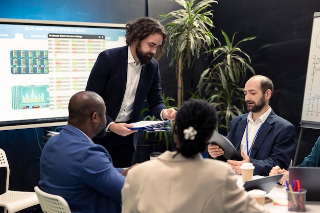 Business professionals discussing oil prices rise amid market uncertainty.