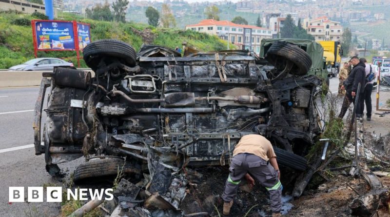 Professionals discuss the Israel Hezbollah conflict during a tense meeting.