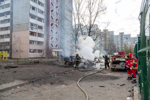 Emergency responders at the scene of Israeli airstrikes in Lebanon, showcasing destruction and chaos.
