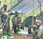 Group of rescued civilians from the Congo, showing hope after escape from militant group.