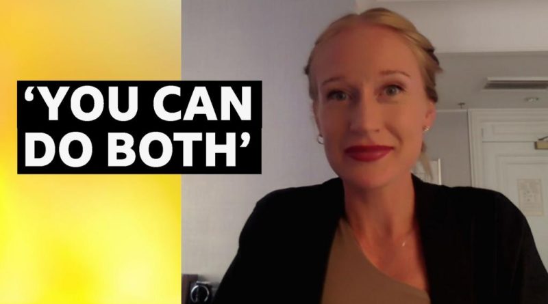 Pregnant runner competing at the Boston Marathon, showcasing her strength and determination.