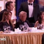 Security personnel ensuring safety during an event where Trump was evacuated.