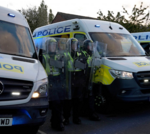 Epsom rape protest with diverse crowd demonstrating peacefully.