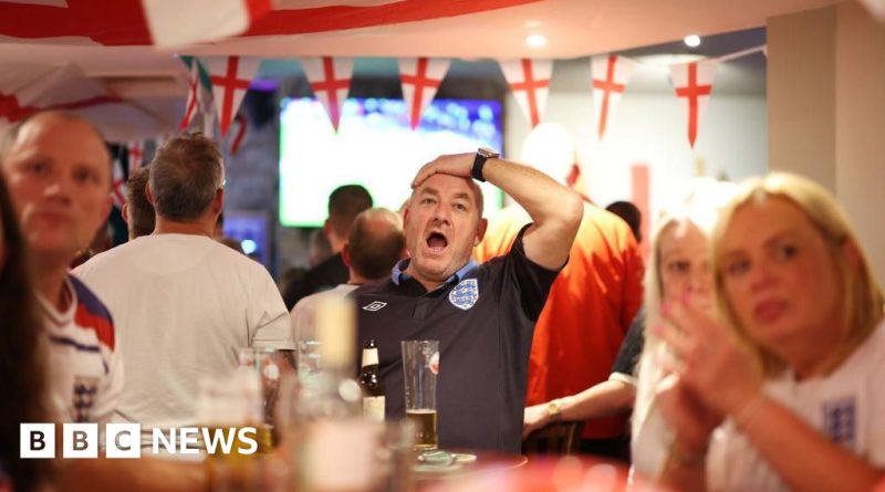 A lively pub scene celebrating World Cup opening hours with fans enjoying drinks.