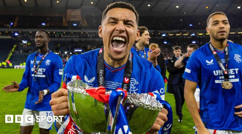 Rangers FC captain Tavernier with teammates on the pitch, celebrating teamwork.