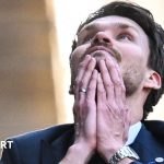 Rangers must win match against Hearts, players strategizing on the sidelines.