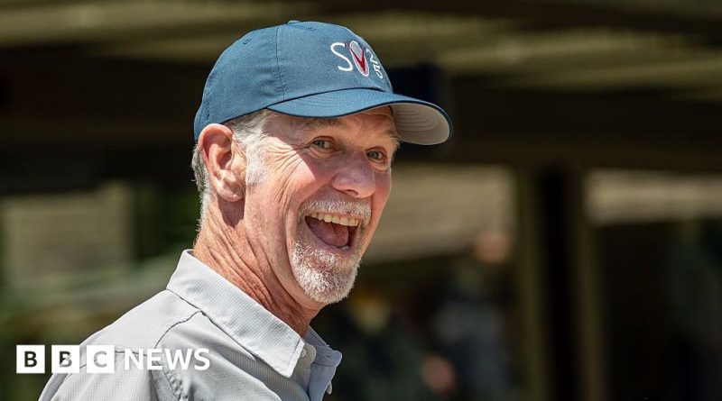 Diverse business professionals discussing strategy in a meeting room, highlighting Reed Hastings Netflix chairman.
