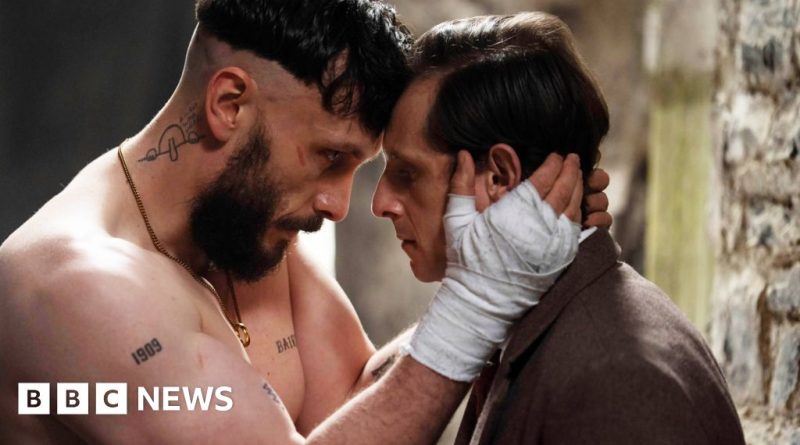 Two young men in professional attire discuss friendship and conflict in Richard Gadd's new drama.