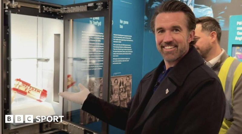 Visitors exploring the Wrexham Football Museum, celebrating Welsh football history.