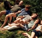 William and Catherine anniversary photo with their three children on grass.