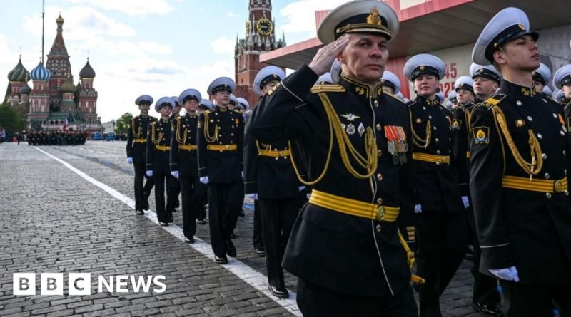 Crowd gathered for the Victory Day parade in Moscow, emphasizing the event's solemnity and history.