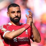 A serious discussion about Salah's future at Liverpool with professional attire.