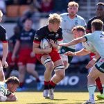 Celebration scene showing Saracens playoff hopes after a rugby match.