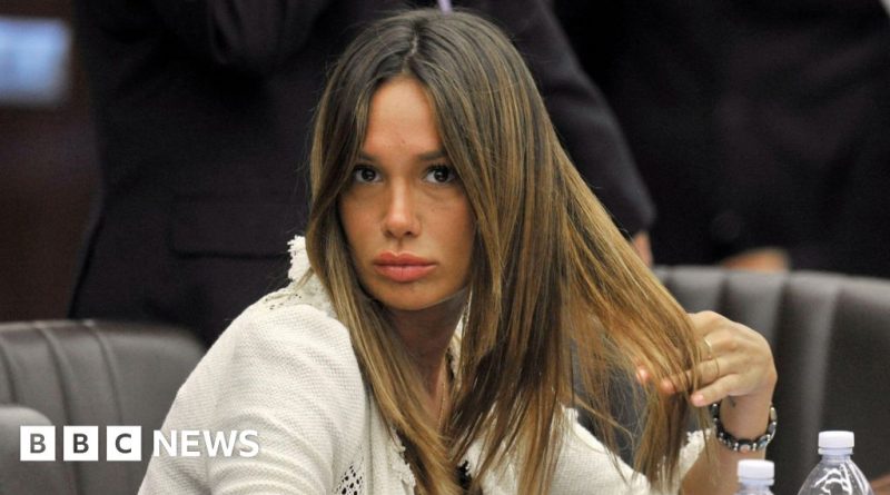 A serious discussion about the Nicole Minetti pardon in a professional setting.