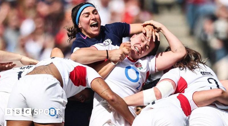Crowd cheering during the Scotland England match at Murrayfield Stadium.