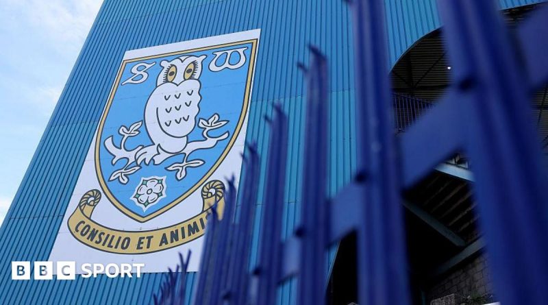 Group discussing Sheffield Wednesday penalty in a business setting.