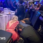 Guests at a gala responding to the White House shooting incident.