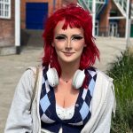 Shoppers at a renovated high street, discussing the future of local businesses.
