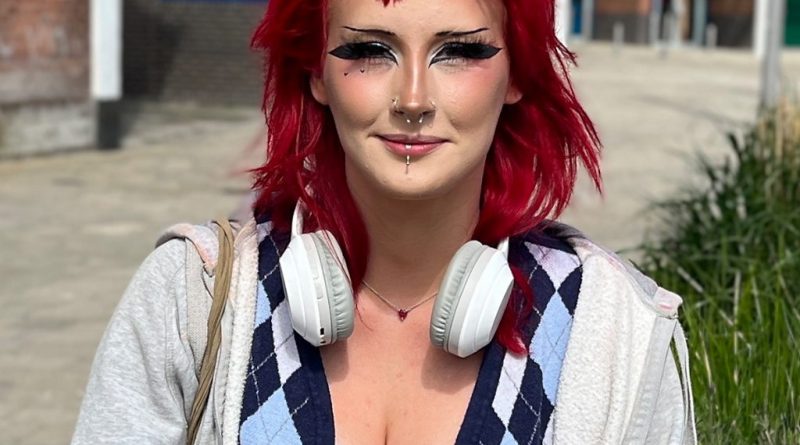 Shoppers at a renovated high street, discussing the future of local businesses.