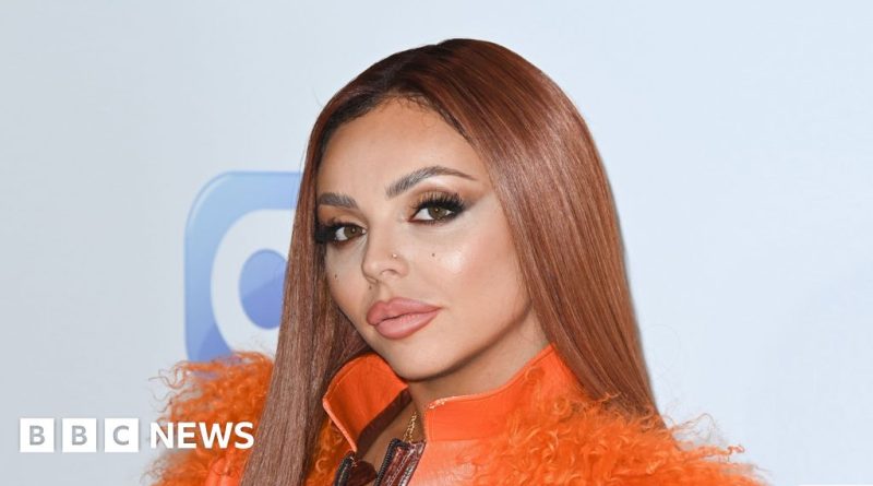 Concerned woman in professional attire near stolen car offering a reward.