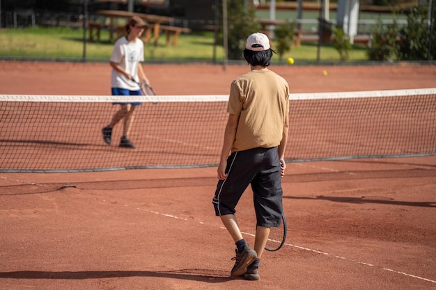 Exciting scene of Sinner and Alcaraz competing on a clay court.