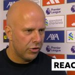 Referee discussing an injury during the Liverpool match, highlighting the focus on player safety.