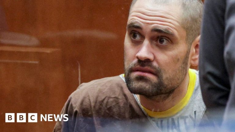 A young man in professional attire reflecting on tragic deaths and family loss.