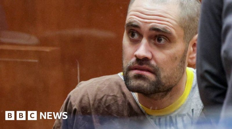 A young man in professional attire reflecting on tragic deaths and family loss.