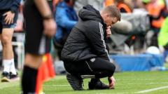 NASA staff monitoring weather conditions for Endeavour landing delay.