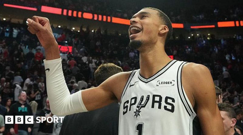 Wembanyama playoff return with energetic fans in the basketball arena.