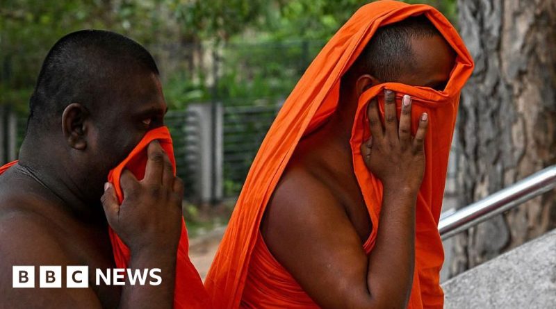 Sri Lankan monks at airport being inspected for cannabis.