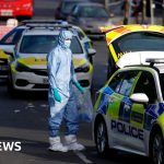 Scene depicting community members discussing Golders Green stabbings.