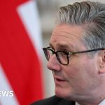 Starmer Commons scandal with diverse politicians in formal attire discussing serious matters.