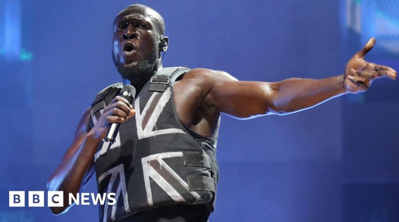 A display featuring Stormzy's vest and other Black British music artifacts.
