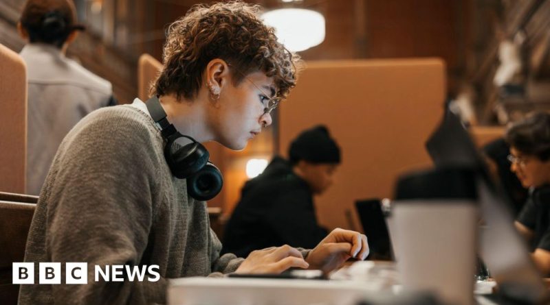 Students celebrating loan repayment relief in a university setting.