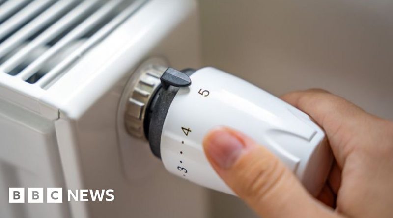 Professionals discussing the heating oil support program in an office.