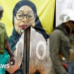 Group mourning at a memorial for victims of Tanzania election violence.