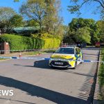 Police officers and community members at the Kenton synagogue arson scene.