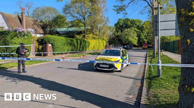 Police officers and community members at the Kenton synagogue arson scene.