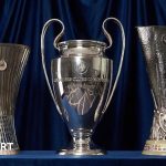 Football executives discussing Premier League European qualification strategies in a meeting.