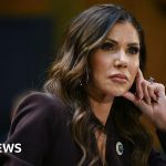 A handbag theft situation at a restaurant involving professional attire.