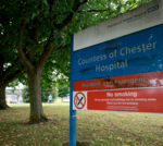 A focused meeting among hospital executives discussing leadership issues.