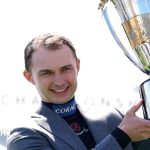 Jockeys in professional attire discussing racing calendar changes.