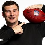 A diverse group of NFL Draft prospects discussing strategies with anticipation.