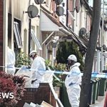 A community gathering showing support after a tragic house fire deaths.