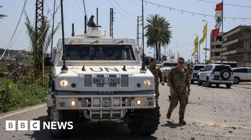 A group of peacekeepers in professional attire showing concern for the French peacekeeper killed.