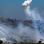 Emergency responders in southern Lebanon assist victims after attacks.