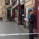 Emergency responders at a car accident scene in London, highlighting the focus on safety.