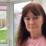 A couple at a hotel reception discussing a security incident during their stay.