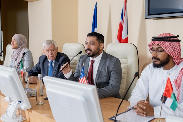 Diplomats discussing the Strait of Hormuz and international relations.